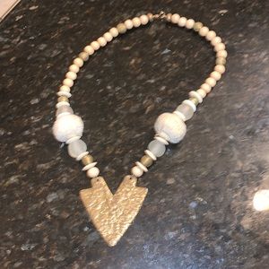 Necklace approx 10 in long. Mix of wooden beads, glass beads and metal.
